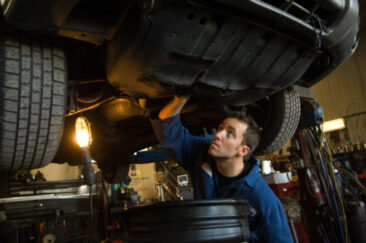 Mechanic repairing car